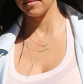 Kourtney kardashian hot sale cross necklace